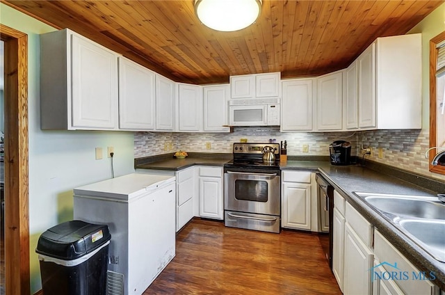 406 N Main St, Continental, OH 45831 - kitchen featuring white cabinetry, stainless steel range with electric stovetop, wood ceiling, dark wood-style floors, and white microwave