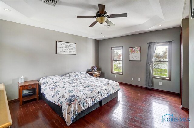 406 N Main St, Continental, OH 45831 - bedroom featuring baseboards, a raised ceiling, visible vents, and wood-type flooring