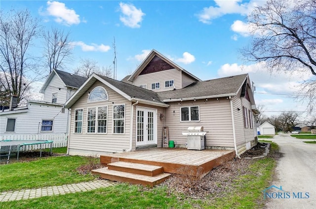 406 N Main St, Continental, OH 45831 - back of property featuring a deck, french doors, and a yard