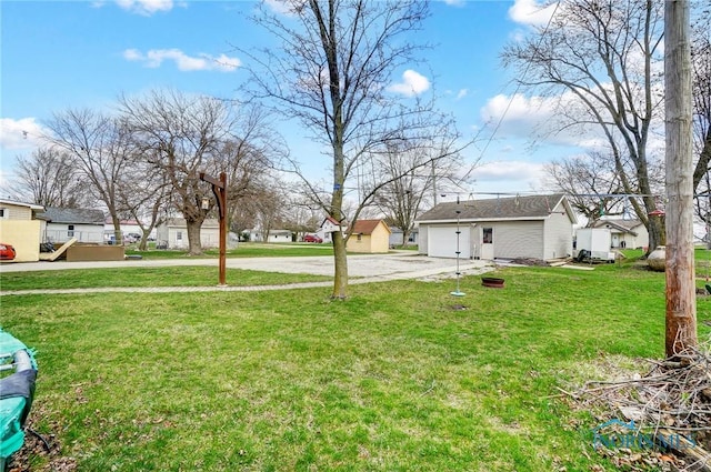 406 N Main St, Continental, OH 45831 - view of yard featuring a residential view, an outbuilding, and a garage