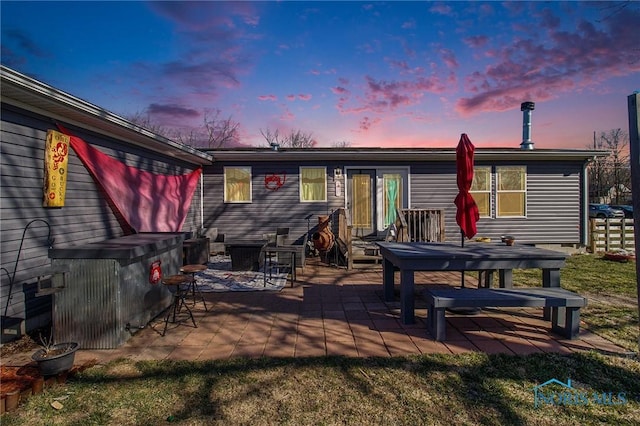 900 E Water St, North Baltimore, OH 45872 - back of house at dusk with a patio