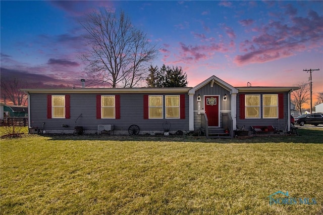 900 E Water St, North Baltimore, OH 45872 - view of front facade with entry steps and a front lawn