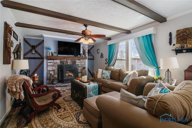 900 E Water St, North Baltimore, OH 45872 - living area with ceiling fan, beam ceiling, ornamental molding, a fireplace, and wood finished floors