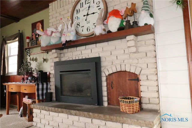 details with a brick fireplace