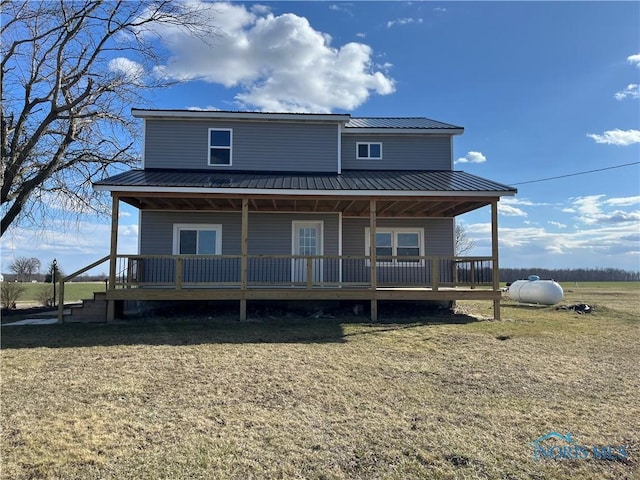 6888 County Road P50, Montpelier, OH 43543 - rear view of house featuring a lawn, metal roof, and a porch