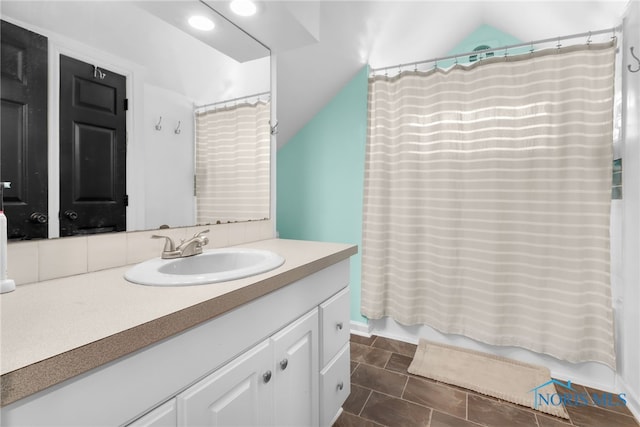 3063 Schneider Rd, Toledo, OH 43614 - bathroom featuring vaulted ceiling, shower / tub combo, and vanity