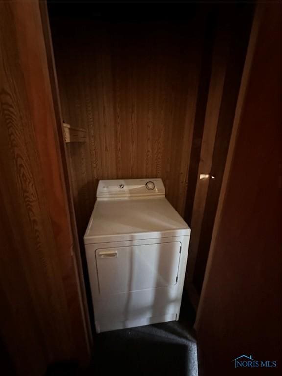 41 Dickens Dr, Toledo, OH 43607 - laundry area with washer / dryer, wooden walls, and laundry area