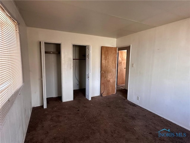 41 Dickens Dr, Toledo, OH 43607 - unfurnished bedroom featuring two closets