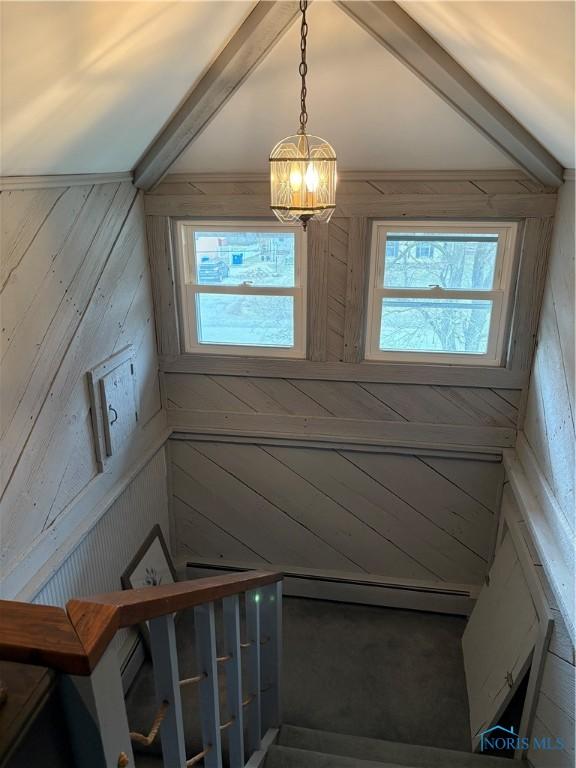 421 Farnsworth Rd, Waterville, OH 43566 - staircase with a chandelier, wooden walls, healthy amount of natural light, and lofted ceiling