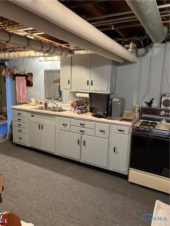 421 Farnsworth Rd, Waterville, OH 43566 - kitchen with black gas range, a sink, white cabinetry, and light countertops