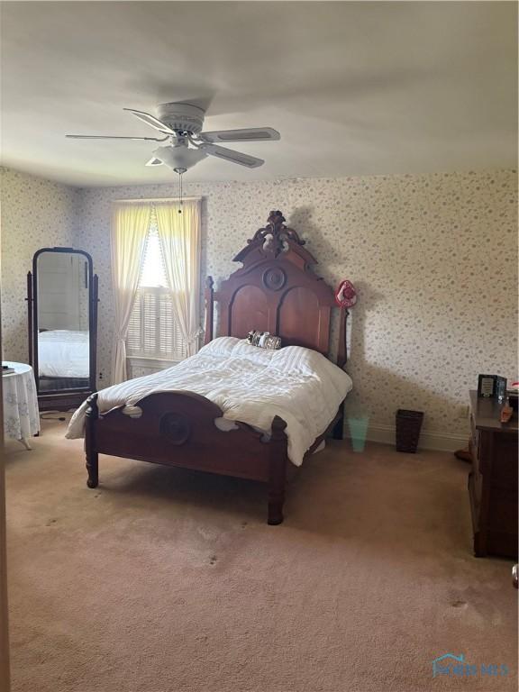 421 Farnsworth Rd, Waterville, OH 43566 - carpeted bedroom with wallpapered walls and a ceiling fan