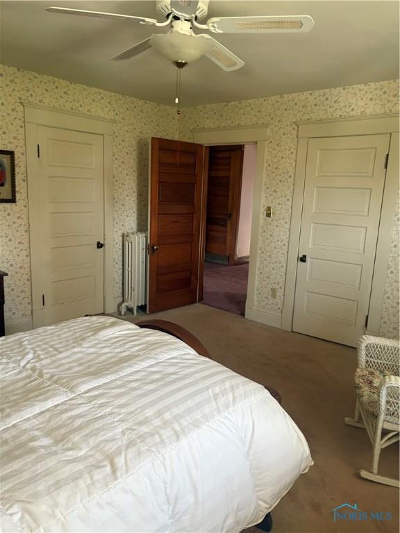 421 Farnsworth Rd, Waterville, OH 43566 - bedroom featuring radiator heating unit, wallpapered walls, and a ceiling fan