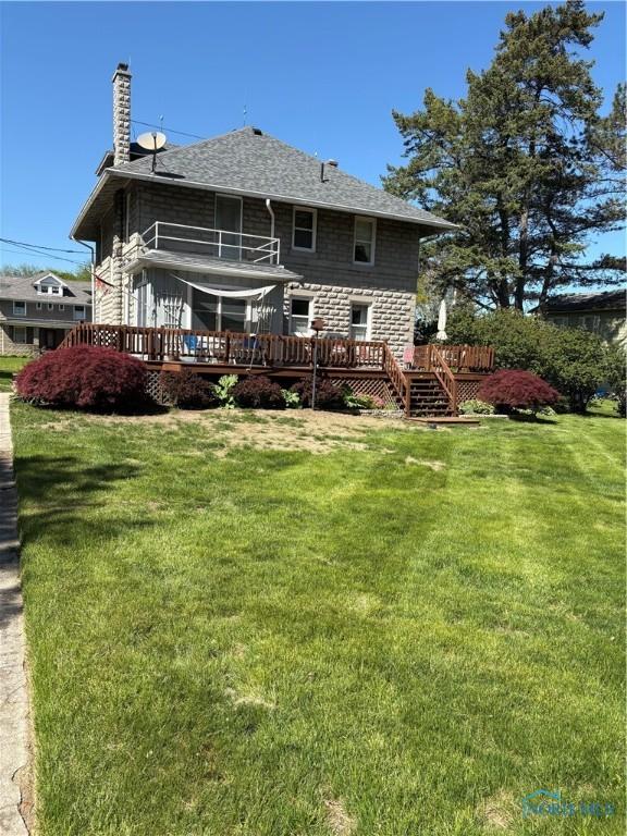 421 Farnsworth Rd, Waterville, OH 43566 - rear view of property featuring a deck, a shingled roof, a lawn, and a chimney