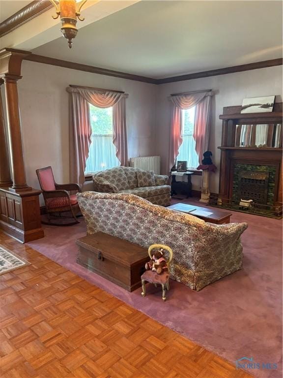 421 Farnsworth Rd, Waterville, OH 43566 - living area with decorative columns, radiator, plenty of natural light, a fireplace, and ornamental molding