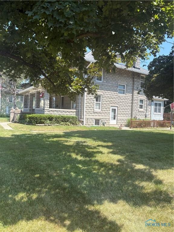 421 Farnsworth Rd, Waterville, OH 43566 - view of front of property featuring a front lawn and stone siding