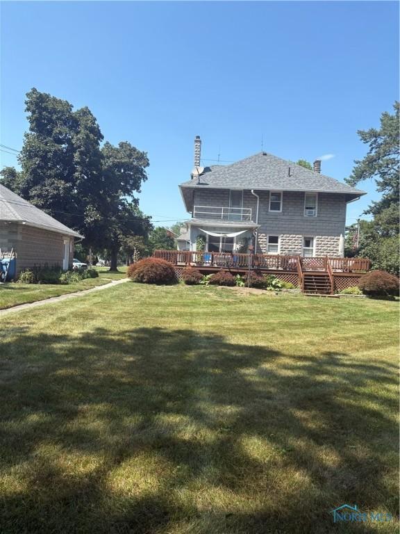 421 Farnsworth Rd, Waterville, OH 43566 - back of house with a lawn, a chimney, a wooden deck, and roof with shingles