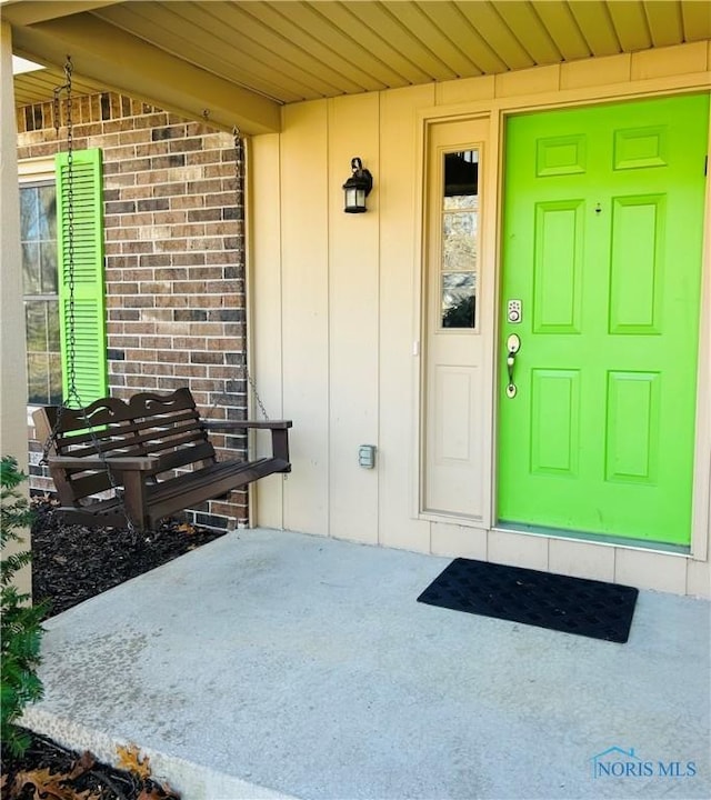doorway to property with board and batten siding