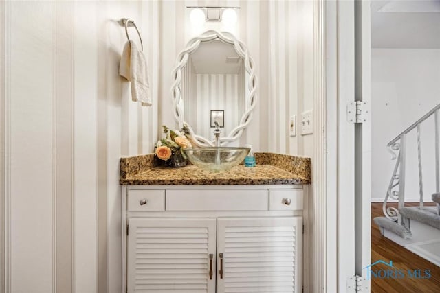 bathroom with vanity and wood finished floors