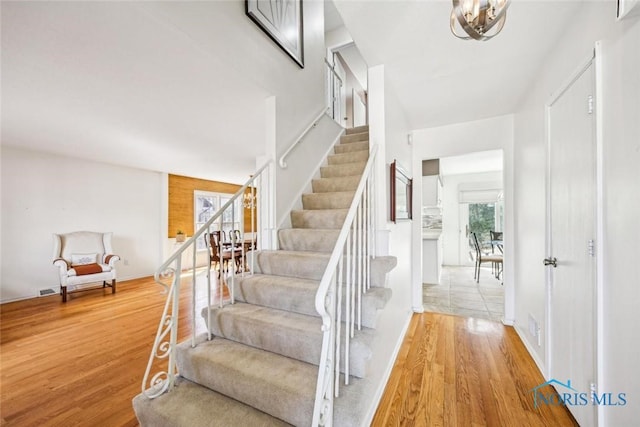 stairs featuring wood finished floors