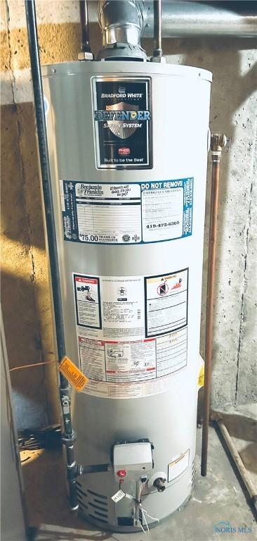 utility room with gas water heater