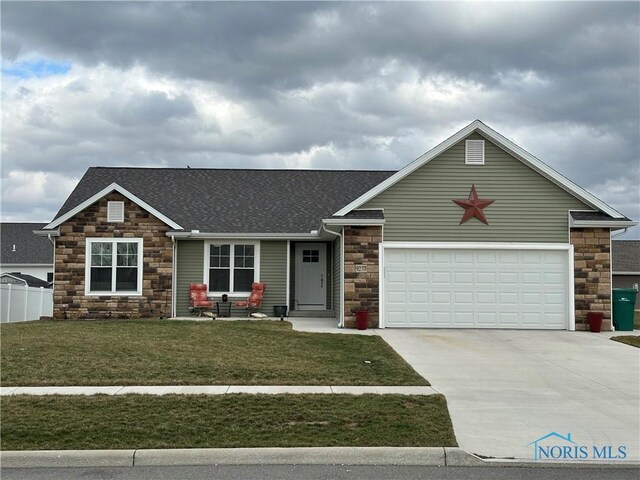 9277 Colonel Dr, Findlay, OH 45840 - view of front of house featuring driveway, stone siding, roof with shingles, fence, and a front lawn