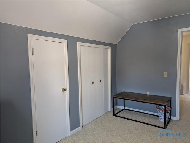 400 W St, Archbold, OH 43502 - interior space with carpet floors, vaulted ceiling, visible vents, and baseboards