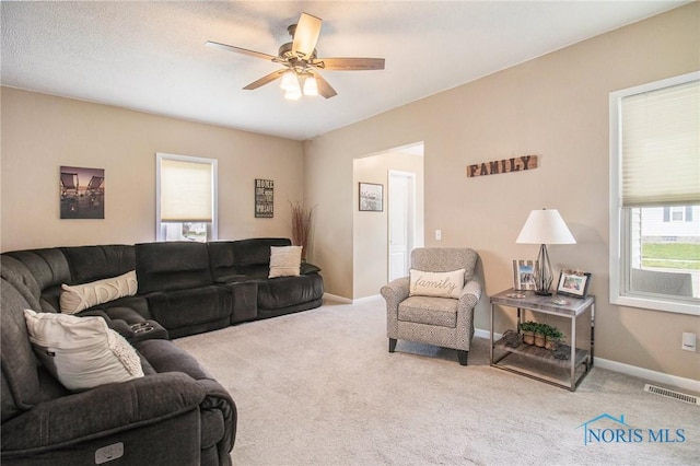 400 W St, Archbold, OH 43502 - living area with carpet floors, visible vents, a ceiling fan, and baseboards