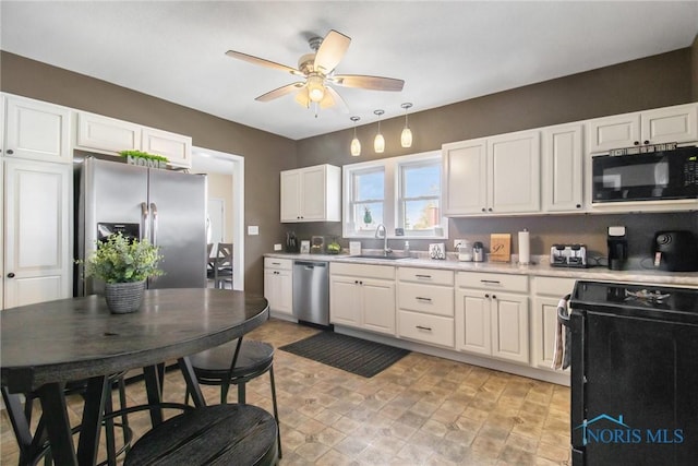 400 W St, Archbold, OH 43502 - kitchen featuring white cabinets, light countertops, a ceiling fan, a sink, and black appliances