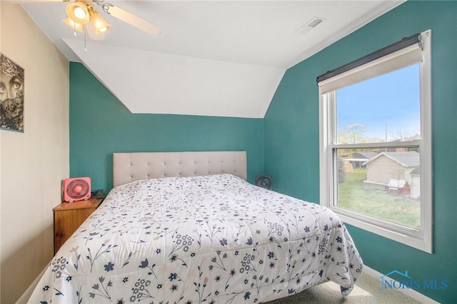400 W St, Archbold, OH 43502 - bedroom featuring vaulted ceiling, visible vents, baseboards, carpet, and ceiling fan