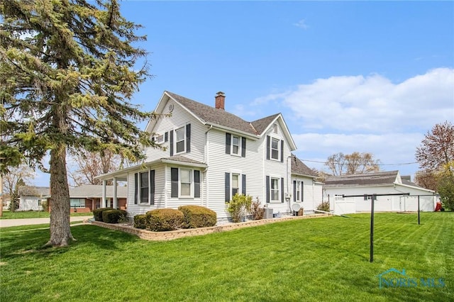 400 W St, Archbold, OH 43502 - view of home's exterior featuring fence, a lawn, a shingled roof, and a chimney