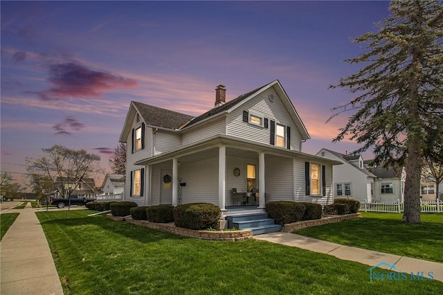 400 W St, Archbold, OH 43502 - farmhouse inspired home with a front yard, a porch, and a chimney