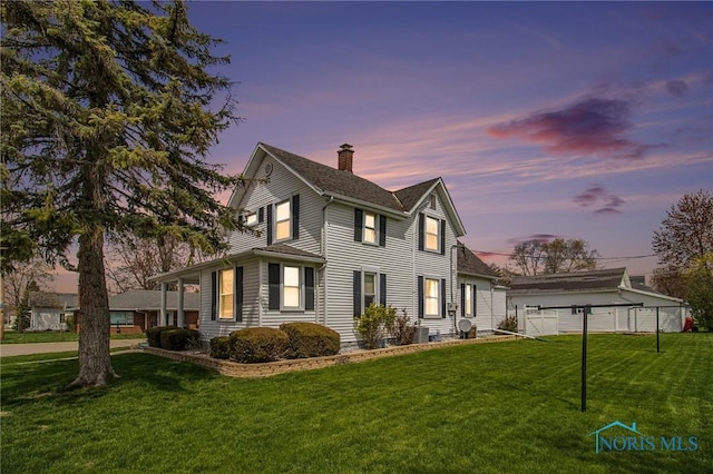 400 W St, Archbold, OH 43502 - property exterior at dusk featuring central air condition unit, a lawn, a chimney, and fence