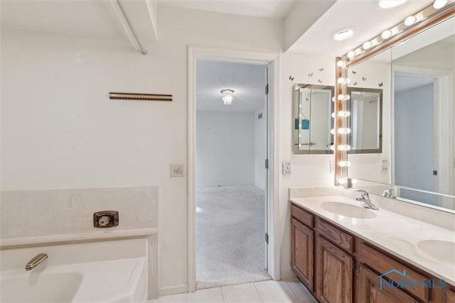 full bath with tile patterned floors, a garden tub, a sink, and double vanity