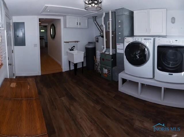 3844 Washburn Rd, Berkey, OH 43504 - washroom with cabinet space, washing machine and dryer, attic access, electric panel, and gas water heater
