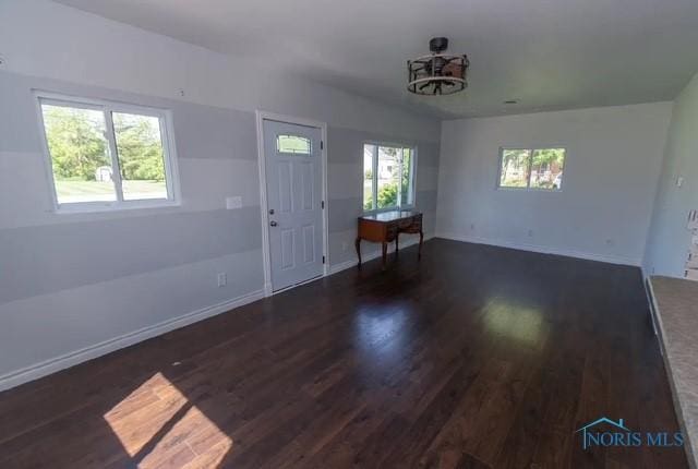 3844 Washburn Rd, Berkey, OH 43504 - unfurnished living room featuring wood finished floors and baseboards