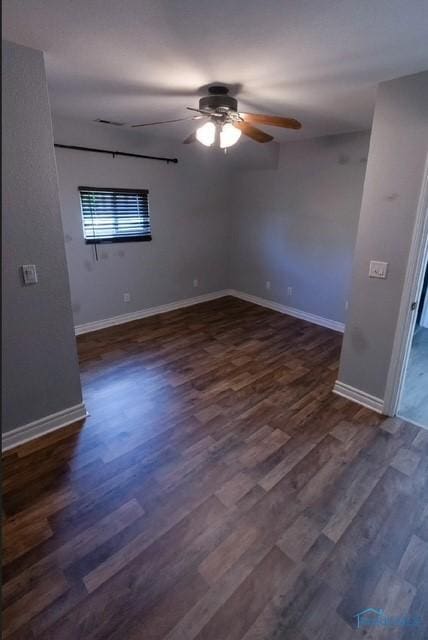 3844 Washburn Rd, Berkey, OH 43504 - empty room featuring a ceiling fan, dark wood-style flooring, and baseboards