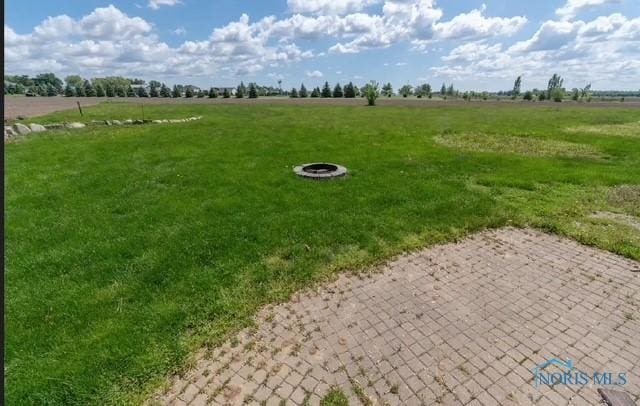 3844 Washburn Rd, Berkey, OH 43504 - view of grassy yard with a view of rural / pastoral area and a fire pit