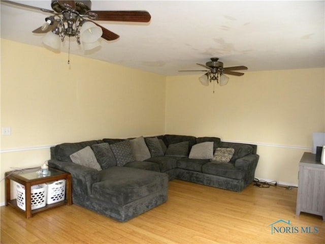 117 Marshall Dr, Swanton, OH 43558 - living area with baseboards, wood finished floors, and a ceiling fan