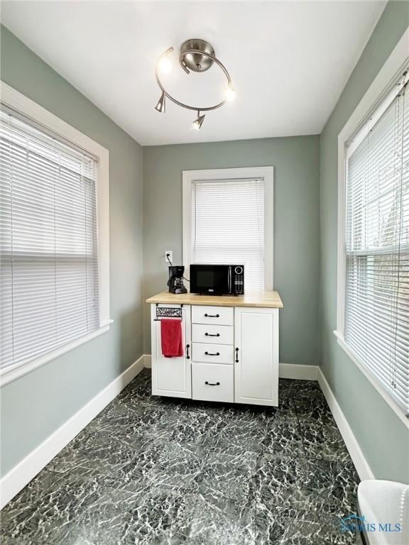 office area featuring baseboards