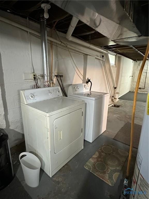 clothes washing area with washer and dryer and laundry area