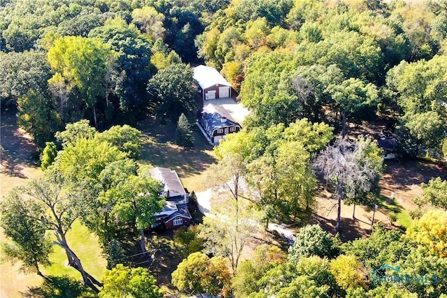 aerial view featuring a wooded view