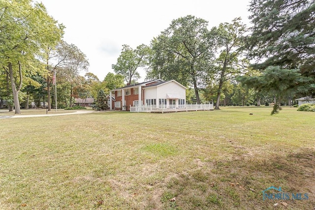 view of yard with a deck