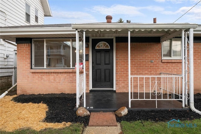 216 Licking St, Toledo, OH 43605 - view of exterior entry featuring brick siding