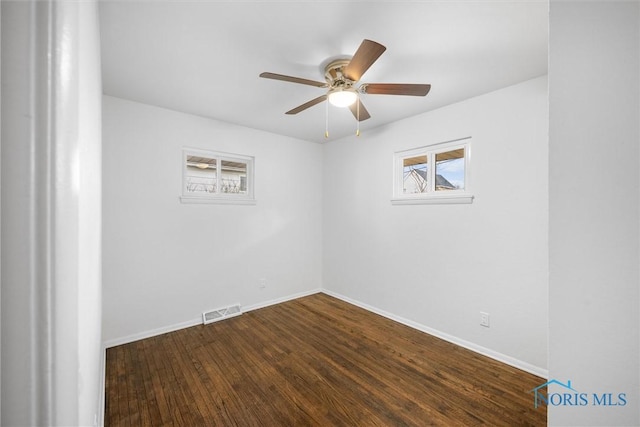 216 Licking St, Toledo, OH 43605 - empty room featuring baseboards, ceiling fan, and dark wood finished floors