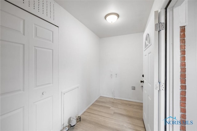 216 Licking St, Toledo, OH 43605 - laundry area with light wood-type flooring and baseboards