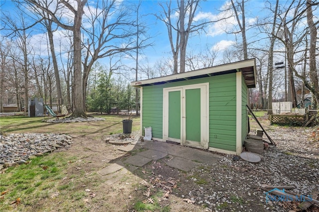 view of shed with fence