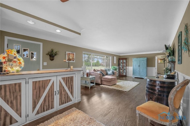 living area with recessed lighting, wainscoting, and dark wood-style floors
