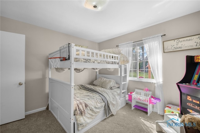 carpeted bedroom with baseboards