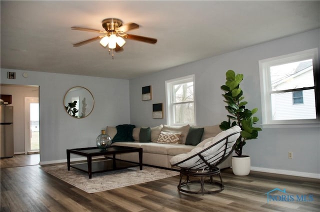 314 Caldwell St, Bradner, OH 43406 - living area with ceiling fan, wood finished floors, and baseboards