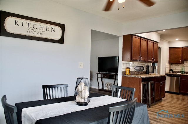 314 Caldwell St, Bradner, OH 43406 - dining space with a ceiling fan and wood finished floors